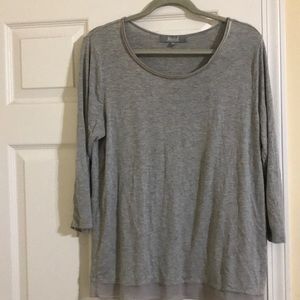grey top with detailing at the bottom